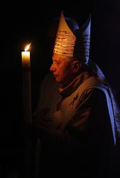 POPE HOLDS CANDLE AS HE CELEBRATES EASTER VIGIL