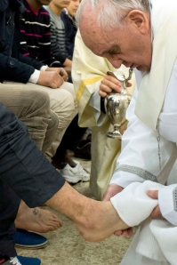 Pope Francis washes the foot of a prisoner at Casal del Marmo youth prison in Rom