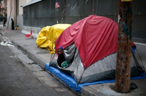 Man wakes up after sleeping in tent on street in downtown Los Angeles