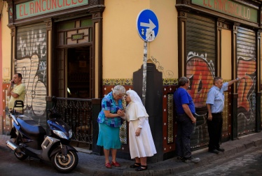 Nun chats with a woman in Spain