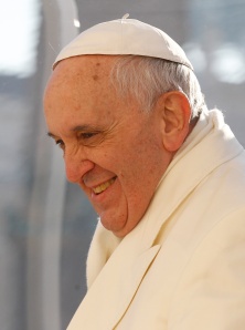 Pope smiles as he arrives to lead general audience in St. Peter's Square at Vatican