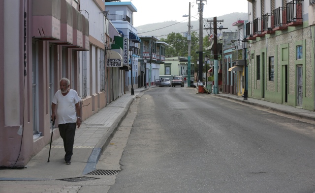 A man walks through an empty street Oct. 21 in Utuato, Puerto Rico. (CNS/Bob Roller)