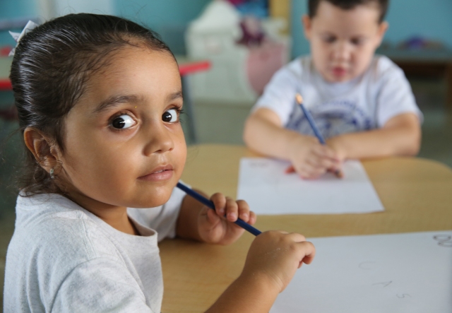 A prekindergarten student looks at the photographer in the classroom at Good Heart of Mary Catholic School in San Juan, Puerto, Rico, Oct. 26. (CNS/Bob Roller)